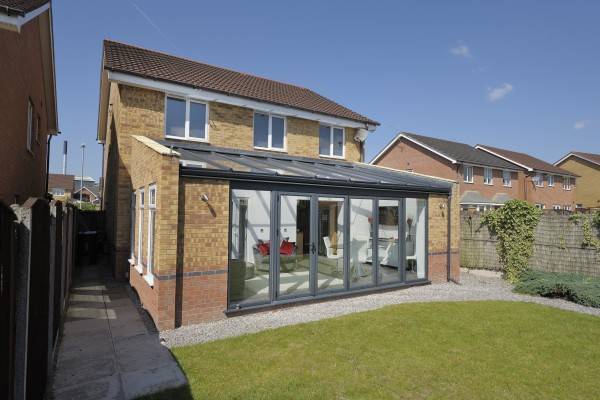 Lean-to conservatory with bi-fold doors