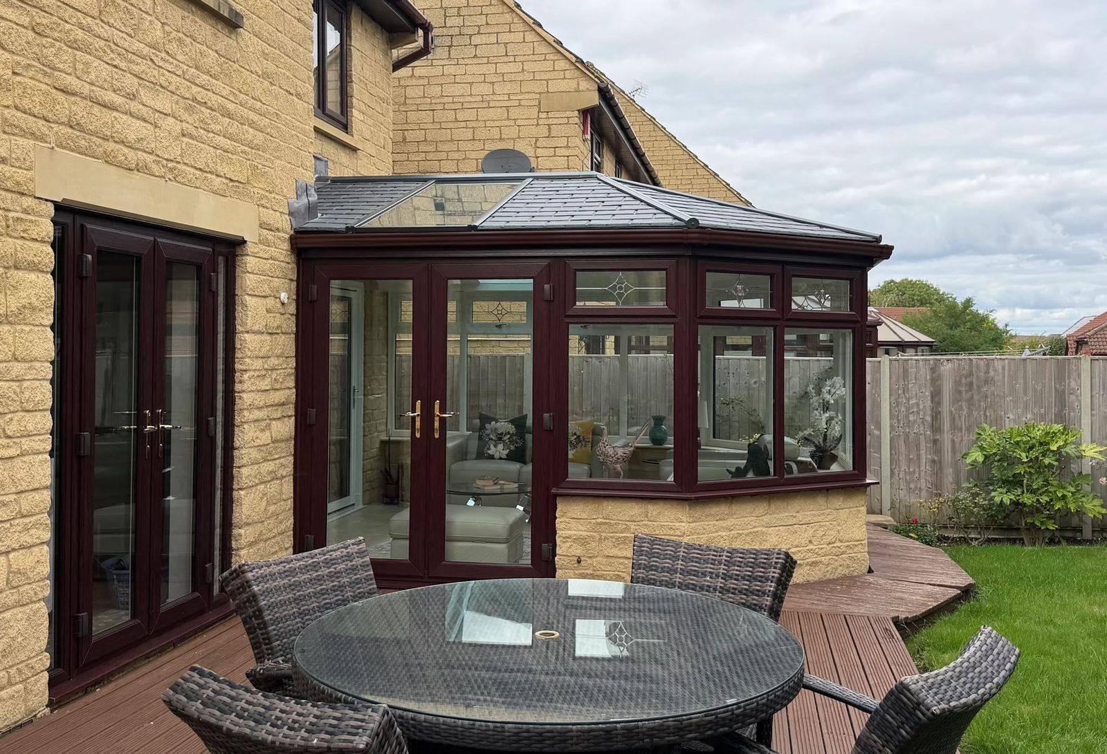 Ultraroof tiled conservatory roof in Cheltenham seen from the patio with rosewood frames