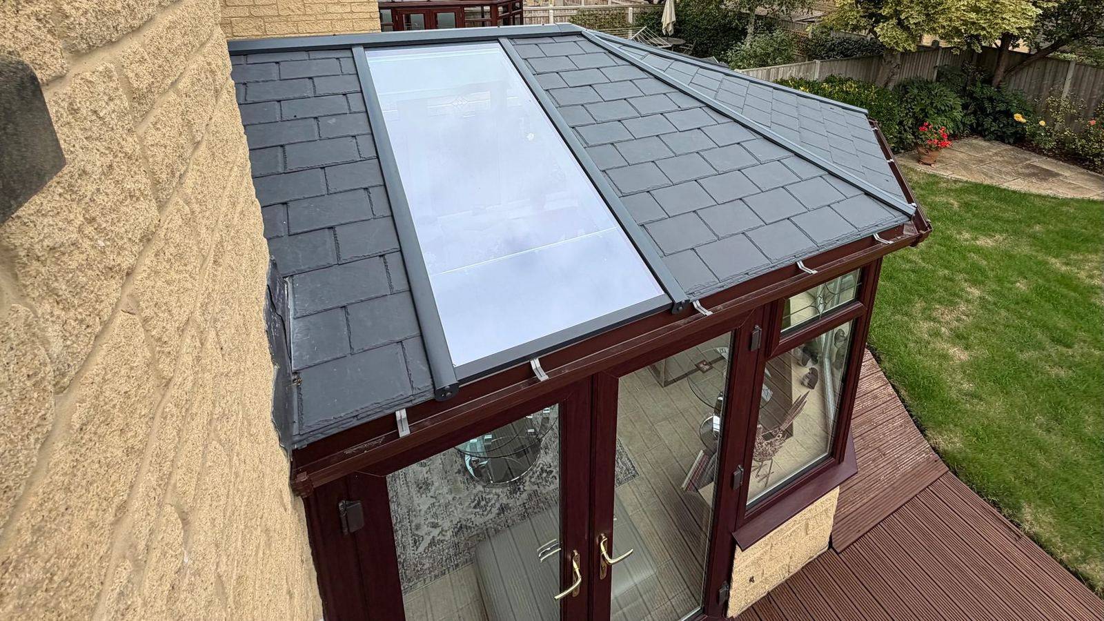 Close-up of an Ultraroof tiled conservatory roof with a full-length glazed panel